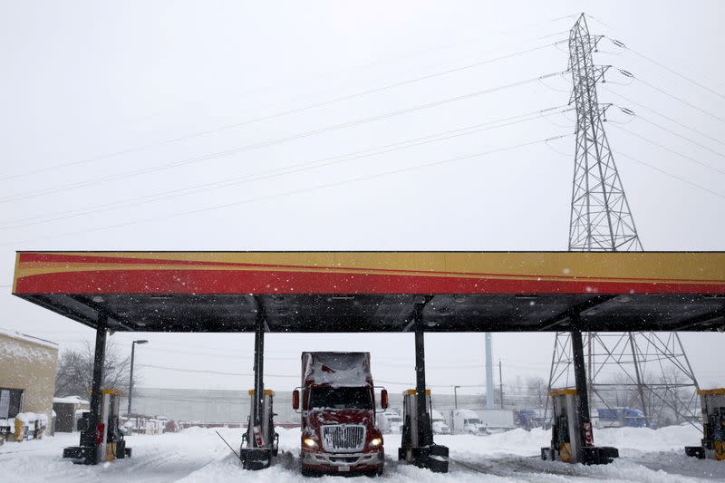 FILE PHOTO: A freight truck waits at a fuel stop during a winter storm near Trenton