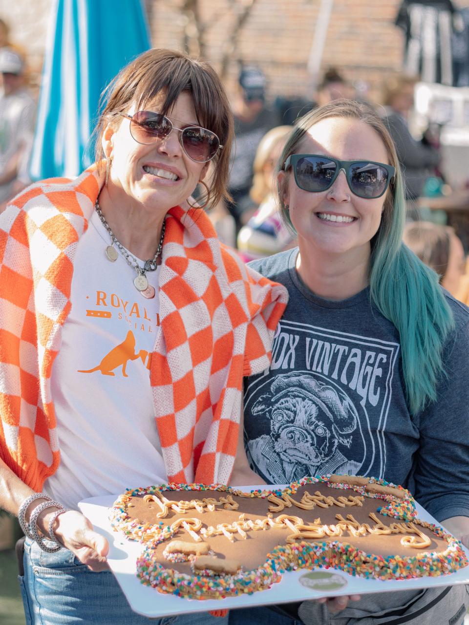 Alisa Hamby of the Royal Bark Social Club and Cassie Krause of Knox Vintage Pet Project (KVPP) and Cassie Leigh Photography, which specializes in pet photography, are all smiles at the “Mother Puppin’ Birthday Pawty” fundraiser for KVPP at Merchants of Beer. Oct. 8, 2023