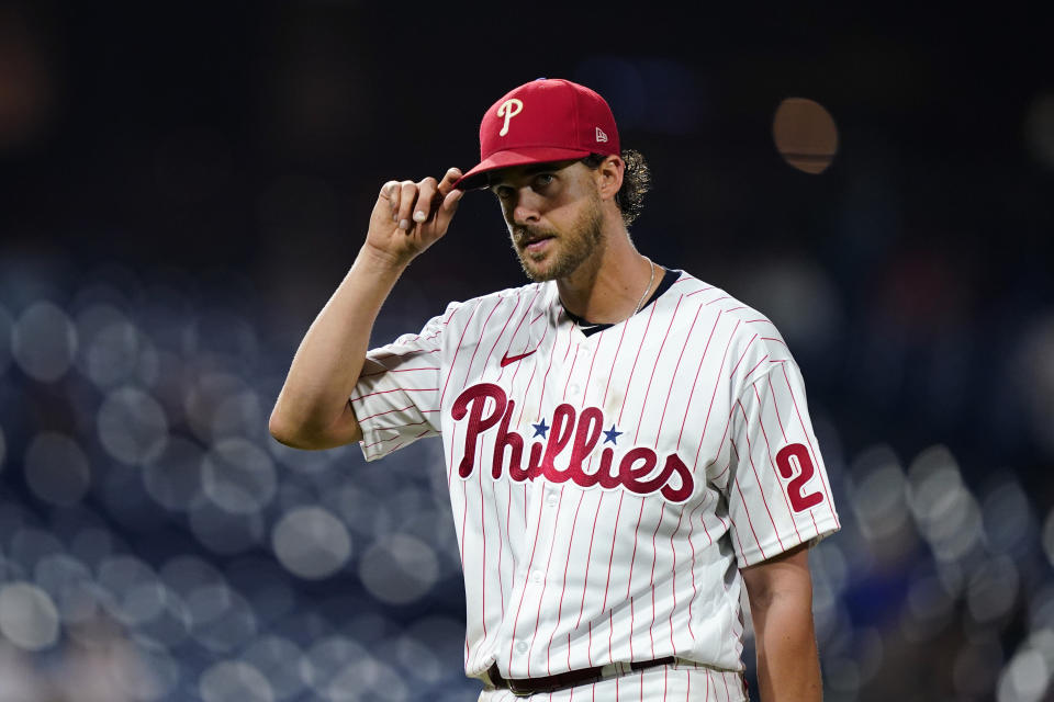 Philadelphia Phillies pitcher Aaron Nola acknowledges the crowd as he walks off the field after being pulled during the seventh inning of a baseball game against the Miami Marlins, Tuesday, Sept. 6, 2022, in Philadelphia. (AP Photo/Matt Slocum)