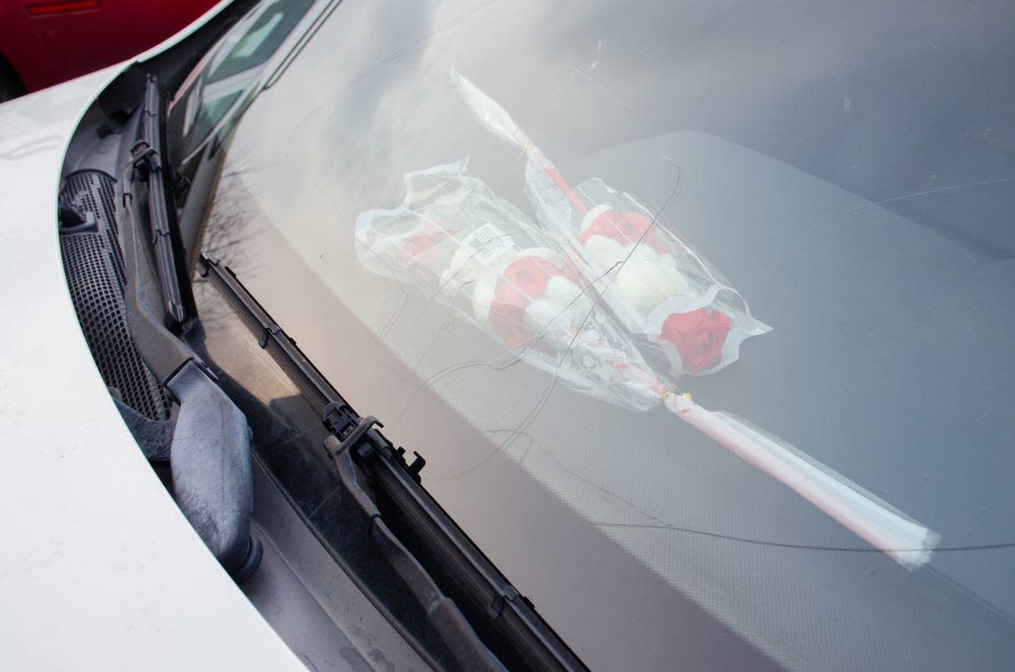 Roses lie on the dash of a 2012 Mercedes E350 parked at a home in Kennewick, Wash. The car was supposed to be a birthday present for Maria Moreno-Reyes. She died one month before her 18th birthday. Eric Rosane/erosane@tricityherald.com