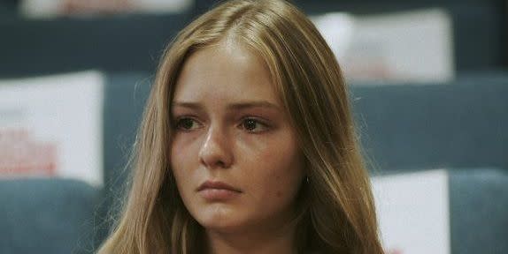 a photo of maya kowalski in a courtroom looking upset