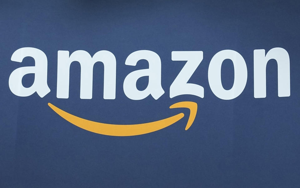 FILE - The Amazon logo is seen, June 15, 2023, at the Vivatech show in Paris. Amazon.com is being added to the Dow Jones Industrial Average, joining Apple, Walt Disney, Walmart and other companies that make up the 30-stock average. (AP Photo/Michel Euler, File)