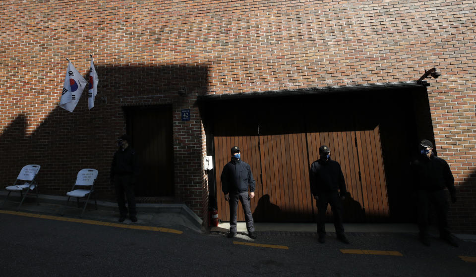 Members of Presidential Security Service stand outside of a residence of former President Lee Myung-bak in Seoul, South Korea, Thursday, Oct. 29, 2020. South Korea's top court upheld a 17-year sentence imposed on former President Lee for a range of corruption crimes in a final ruling Thursday that will send him back to prison. (AP Photo/Lee Jin-man)