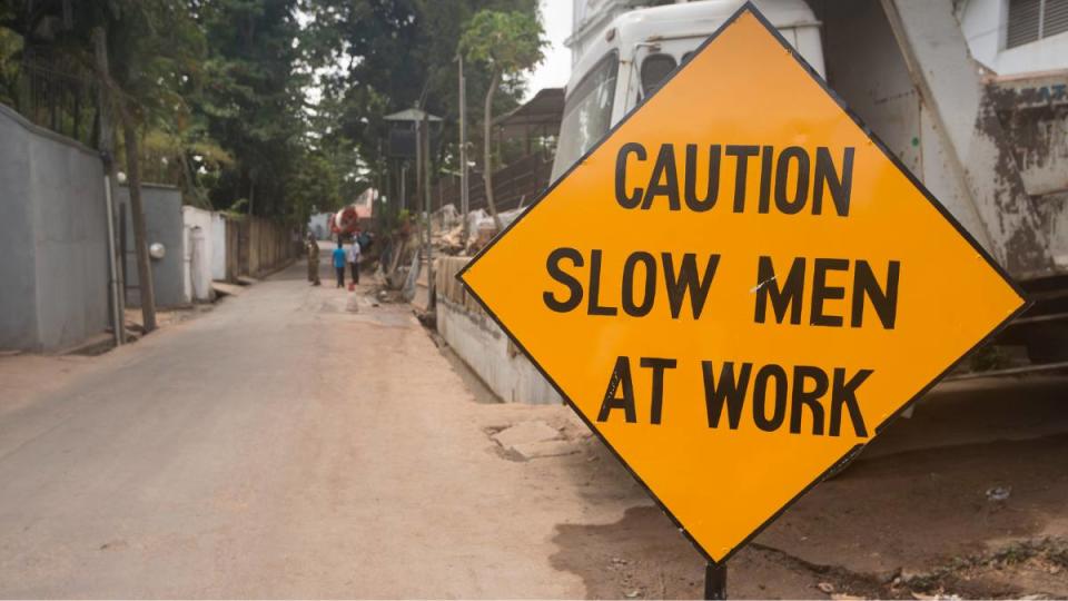 A street warning sign Caution Slow Men at Work sign which appears humorous as it reads that the men are Slow Men (Funny road signs )