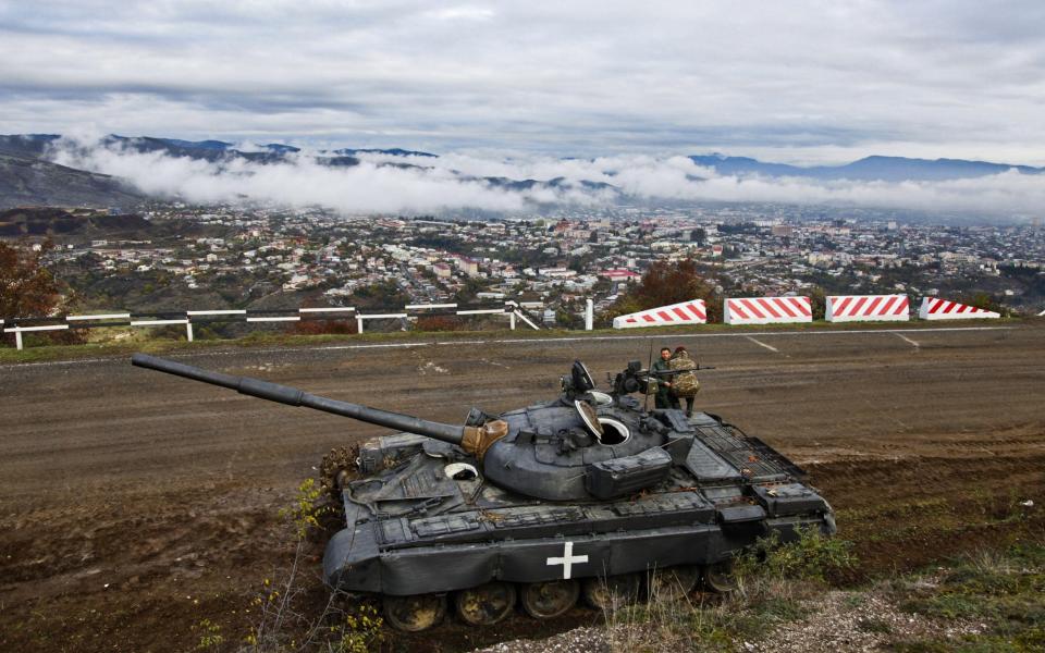 An Armenian tank holds the line above Stepanakert in Nagorno Karabakh following the ceasefire - JACK LOSH FOR THE TELEGRAPH