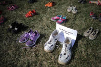 <p>7,000 pairs of shoes, representing the children killed by gun violence since the mass shooting at Sandy Hook Elementary School in 2012, are spread out on the lawn on the east side of the Capitol March 13, 2018 in Washington. (Photo: Chip Somodevilla/Getty Images) </p>