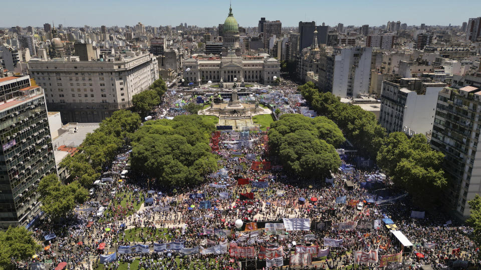 People rally outside Congress during a national strike against the economic and labor reforms proposed by Argentine President Javier Milei in Buenos Aires, Argentina, Wednesday, Jan. 24, 2024. (AP Photo/Rodrigo Abd)