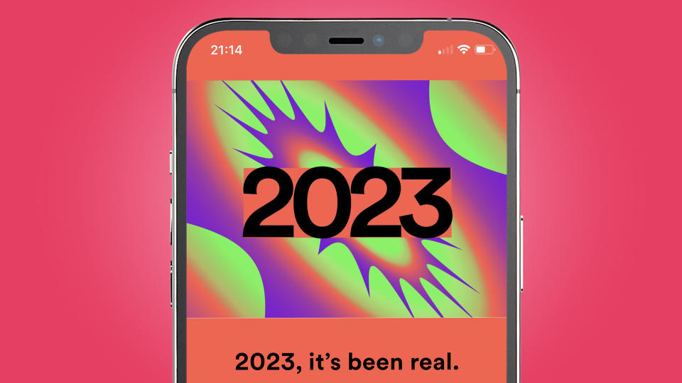  An iPhone on a pink background showing a splash page for Spotify Wrapped 2023. 