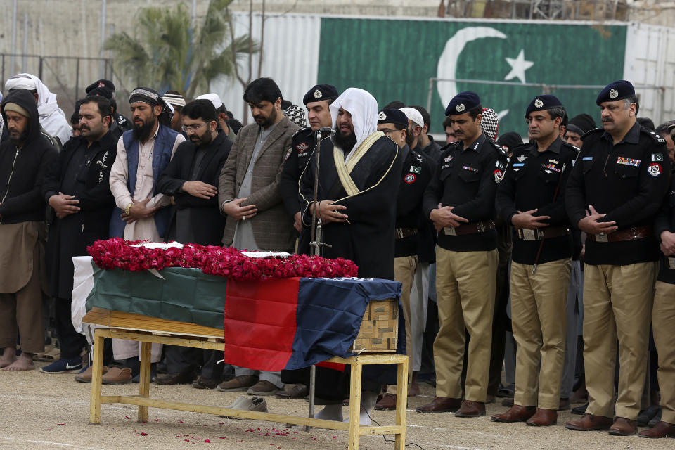 Police officials and others attend the funeral prayer of a police officer, a victim of Monday's suicide bombing, in Peshawar, Pakistan, Feb. 2, 2023. A suicide bomber who killed 101 people at a mosque in northwest Pakistan this week had disguised himself in a police uniform and did not raise suspicion among guards, the provincial police chief said on Thursday. (AP Photo/Muhammad Sajjad)