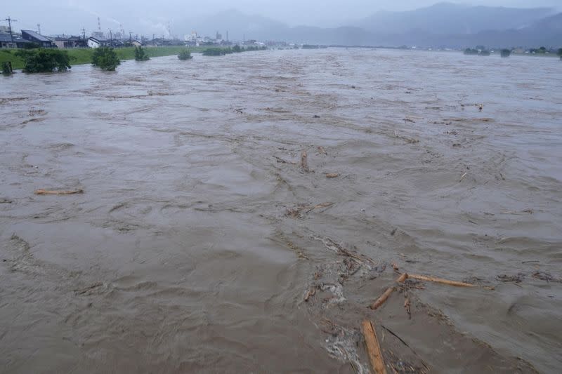 Rising water caused by a heavy rain is seen along Kuma river in Yatsushiro, Japan