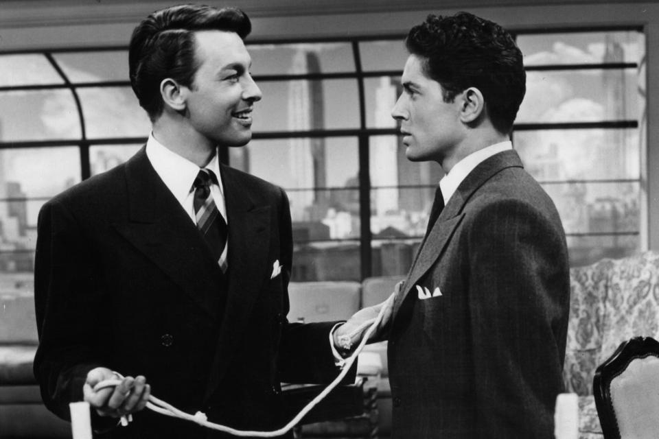 John Dall and Farley Granger talk to each other in a scene from the film 'Rope', 1948. (Photo by Warner Brothers/Getty Images)
