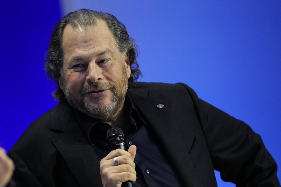 FILE - Salesforce CEO Marc Benioff, right, talks on stage during the Asia-Pacific Economic Cooperation (APEC) CEO Summit Thursday, Nov. 16, 2023, in San Francisco. The $200,100 winning bid for a private lunch with software titan Benioff might appear disappointing at first glance after years of multimillion-dollar bids for a private meal with investor Warren Buffett, but the winner also pledged to donate a total of $1.5 million to the California homeless charity that benefits from the auction. (AP Photo/Eric Risberg, File)