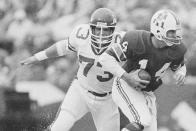 FILE - New York Jets' Joe Klecko, left, has New England Patriots quarterback Steve Grogan on the run during first quarter of an NFL football game at Schaefer Stadium in Foxboro, Mass., Nov. 15, 1981. Super Bowl MVP Chuck Howley and All-Pro defenders Joe Klecko and Ken Riley are finalists for the Pro Football Hall of Fame’s class of 2023. The defenders who starred in the 1960s, 70s and 80s were announced Wednesday, Aug. 17, 2022, as the three senior candidates for next year's Hall of Fame class from a list of 12 semifinalists. (AP Photo/Paul Benoit, File)