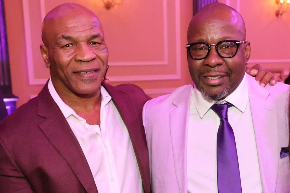 <p>Arnold Turner/Getty</p> Mike Tyson and Bobby Brown