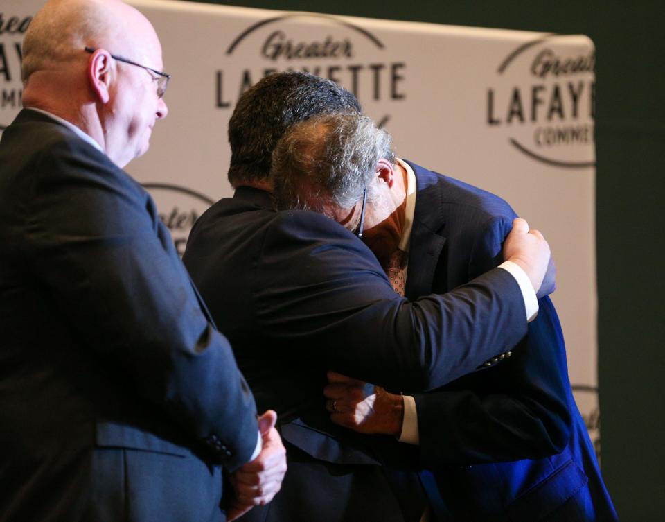 West Lafayette Mayor John Dennis hugs Lafayette Mayor Tony Roswarski after receiving the Sagamore of the Wabash Award from Indiana Gov. Eric Holcomb, on Monday, Feb. 6, 2023, in Lafayette, Ind.