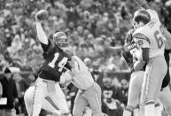 FILE - In this Jan. 10, 1982 file photo, Cincinnati Bengals quarterback Ken Anderson, left, prepares to throw during the AFC championship game against the San Diego Chargers in Cincinnati. Cincinnati Bengals coach Forrest Gregg called the Freezer Bowl -- a 27-7 win over the San Diego Chargers on Jan. 2, 1982 -- worse than the Ice Bowl on Dec. 31, 1967, when he was an offensive lineman for Vince Lombardi's Packers in the most famous cold-weather game in NFL history. (AP Photo/File)