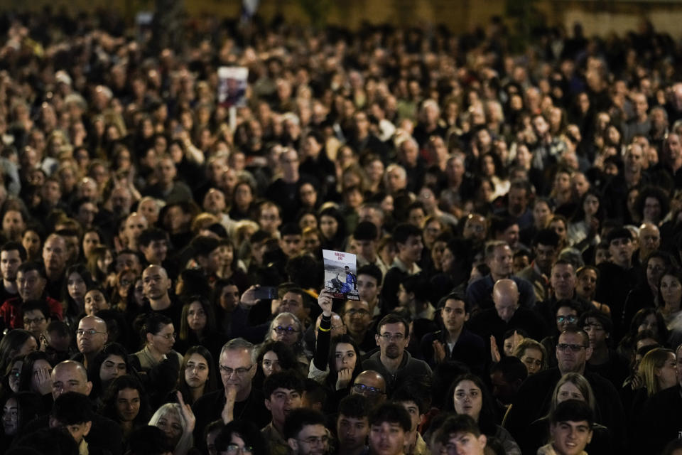Families and supporters of Israeli hostages held by Hamas in Gaza attend a rally calling for their return, in Tel Aviv, Israel, Saturday, Dec. 16, 2023. More than 100 Israeli hostages are held in Gaza after being abducted in a Hamas cross-border attack on Oct. 7. (AP Photo/Leo Correa)