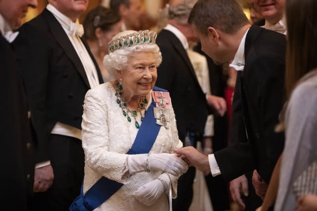 The Queen speaks to guests at the event on Wednesday (Victoria Jones/PA)