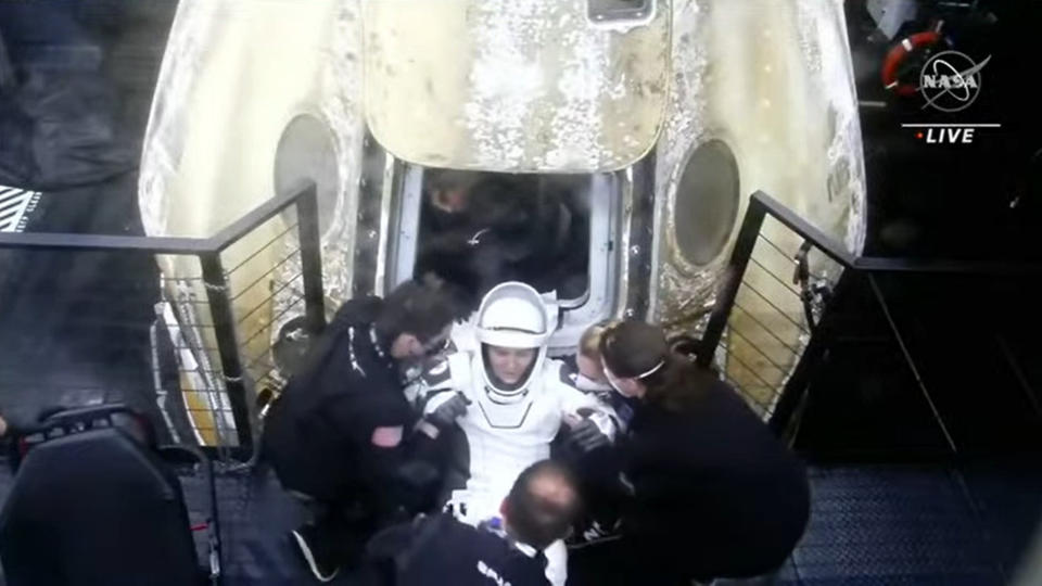 Russian cosmonaut Anna Kikina is helped out of SpaceX's Crew-5 Dragon capsule Endurance after returning to Earth for an ocean splashdown off Florida's coast on March 11, 2023.