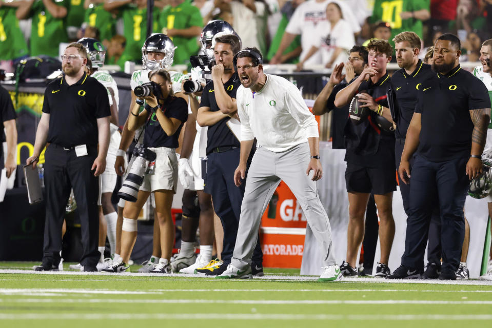 Oregon head coach Dan Lanning shouts to players during the second half half of the team's NCAA college football game against Texas Tech, Saturday, Sept. 9, 2023, in Lubbock, Texas. (AP Photo/Chase Seabolt)