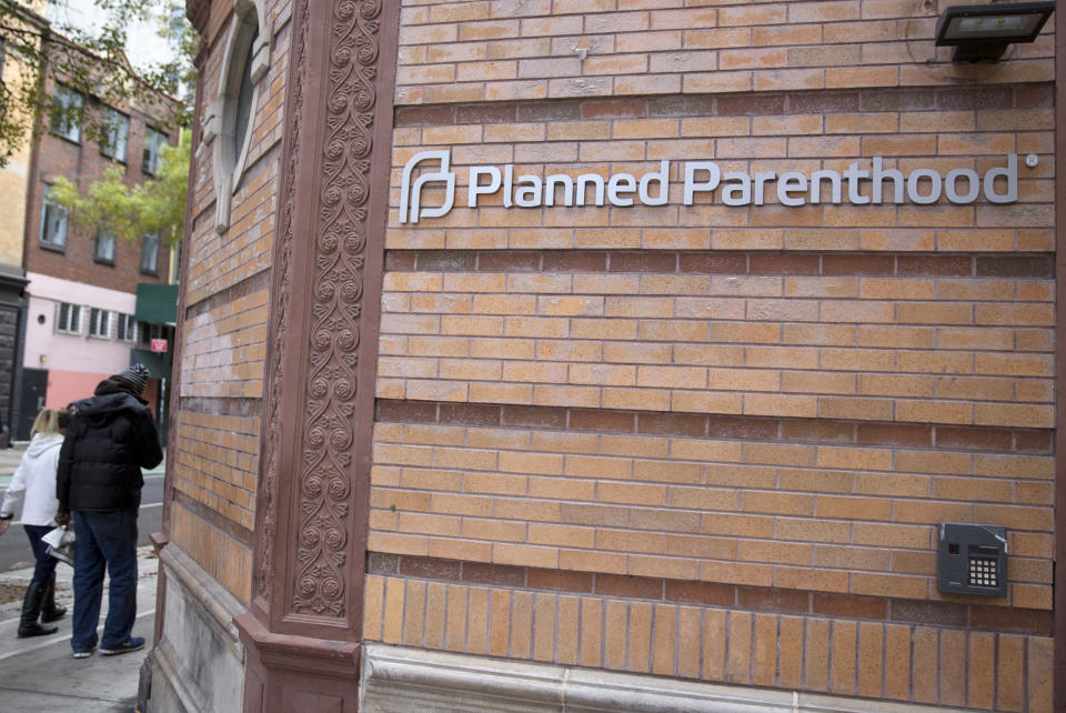 People walk past a Planned Parenthood clinic in the Manhattan borough of New York (Andrew Kelly / Reuters)