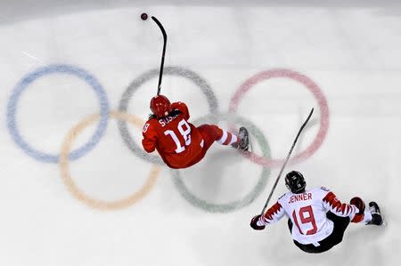 FILE PHOTO - Feb 18, 2018; Gangneung, South Korea; Olympic Athlete from Russia forward Olga Sosina (18) moves the puck against Canada forward Brianne Jenner (19) in the women's ice hockey semifinals during the Pyeongchang 2018 Olympic Winter Games at Gangneung Hockey Centre. Mandatory Credit: David E. Klutho-USA TODAY Sports