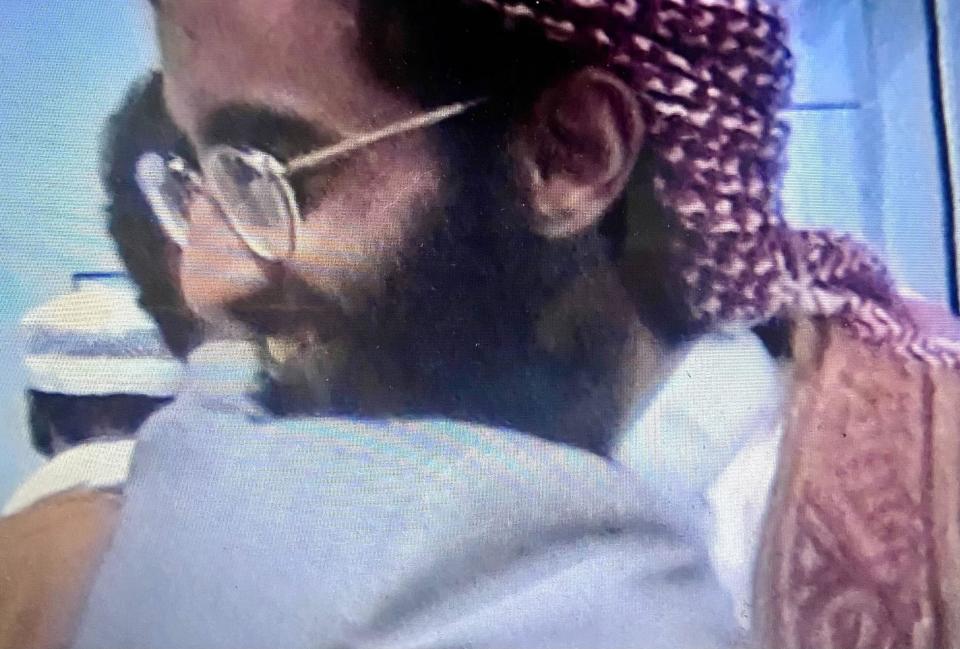 Bayoumi is seen warmly greeting and embracing the American Muslim cleric Anwar al-Awlaki.  