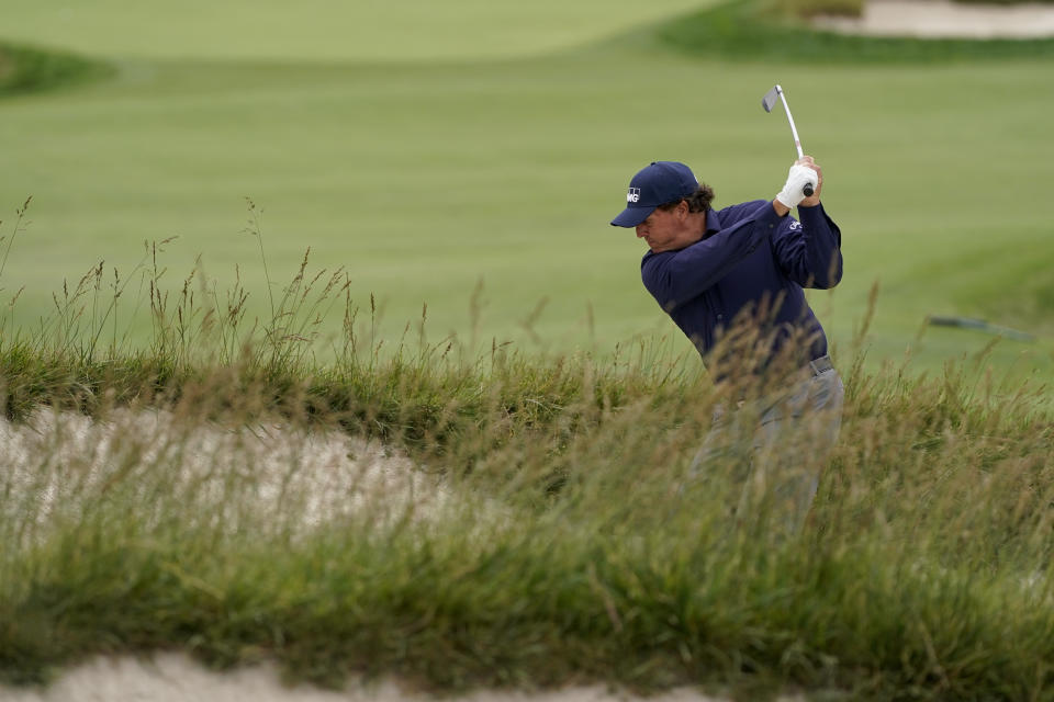 Phil Mickelson hits from the fairway on the 15th hole during the second round of the U.S. Open golf tournament Friday, June 14, 2019, in Pebble Beach, Calif. (AP Photo/David J. Phillip)