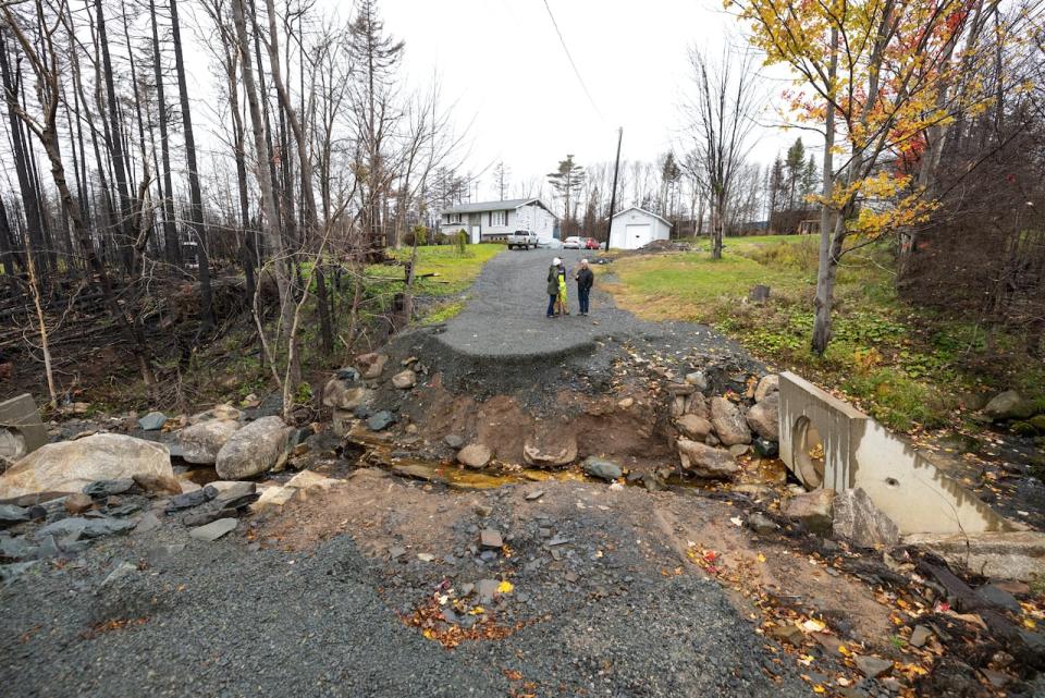 A large gap in Peter Dominey's Yankeetown Driveway formed when the culvert washed out during July's flooding.