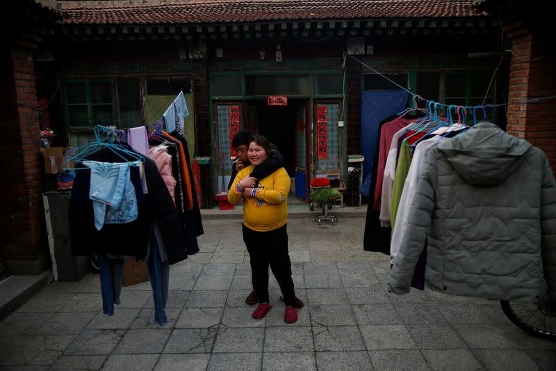 The Wider Image: 'I've let them down': Beijing's migrant workers miss family reunions on Lunar New Year