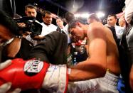 NEW YORK, NY - OCTOBER 20: Erik Morales is tended to as he sits on a stool after being knocked out in the fourth round by Danny Garcia during their WBC/WBA junior welterweight title at the Barclays Center on October 20, 2012 in the Brooklyn Borough of New York City. (Photo by Al Bello/Getty Images for Golden Boy Promotions)