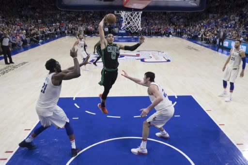 Jayson Tatum of the Boston Celtics goes up to dunk as the Celtics beat Philadelphia 101-98 in overtime to seize a 3-0 lead in the second-round series