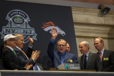 FILE PHOTO: Seattle Seahawks owner and Microsoft co-founder Paul Allen (C) waves to the trading floor after ringing the opening bell at the New York Stock Exchange in New York, U.S., January 30, 2014. REUTERS/Brendan McDermid/File Photo