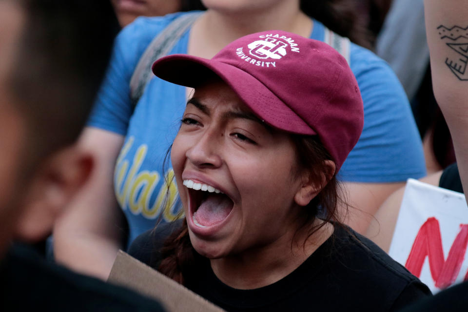 <p>Savilla Fabiola, a Deferred Action for Childhood Arrivals (DACA) program recipient, chants with supporters at City Hall in Los Angeles, Calif., Sept. 5, 2017. (Photo: Kyle Grillot/Reuters) </p>