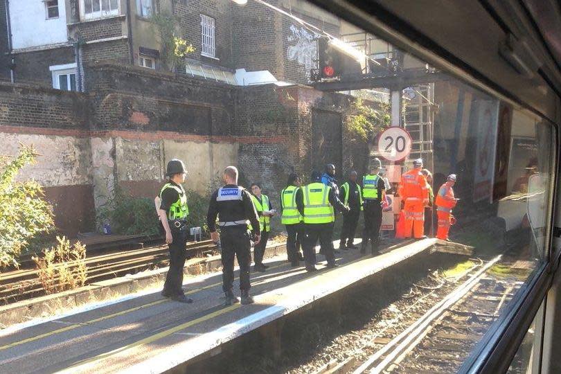 Emergency services and rail staff work to clear the broken down train outside Victoria: Chris Hayward