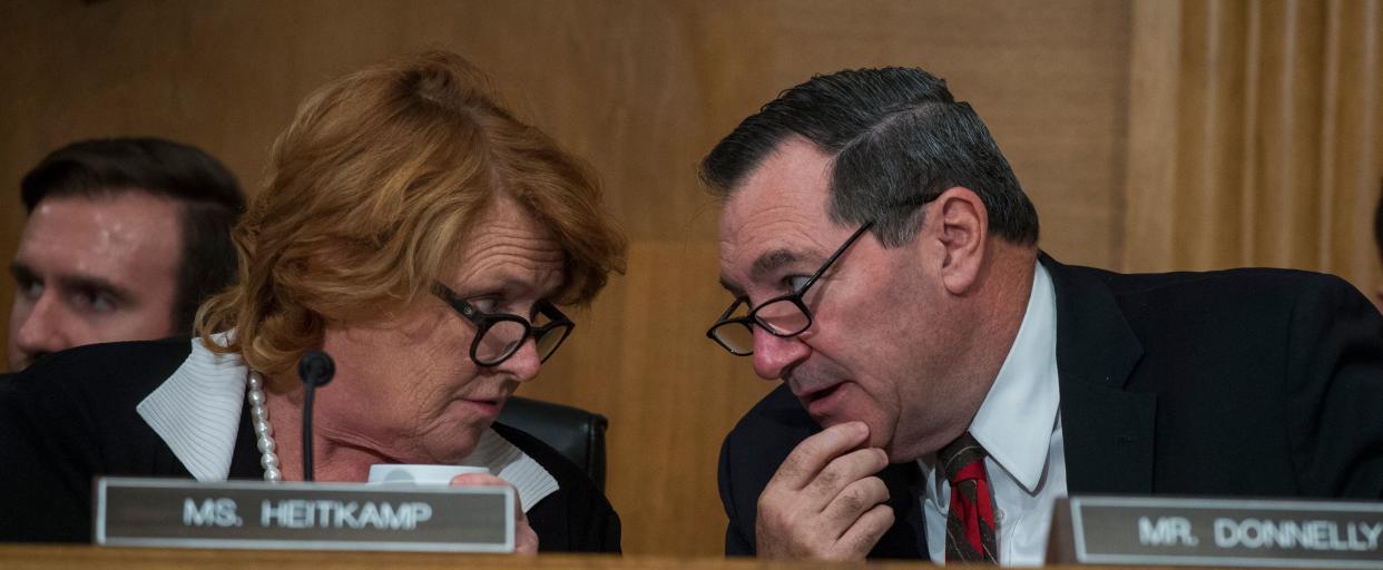 Sens. Heidi Heitkamp of North Dakota and Joe Donnelly of Indiana backed the banking industry bill. Last week, their constituents didn't back them. (Photo: Tom Williams via Getty Images)