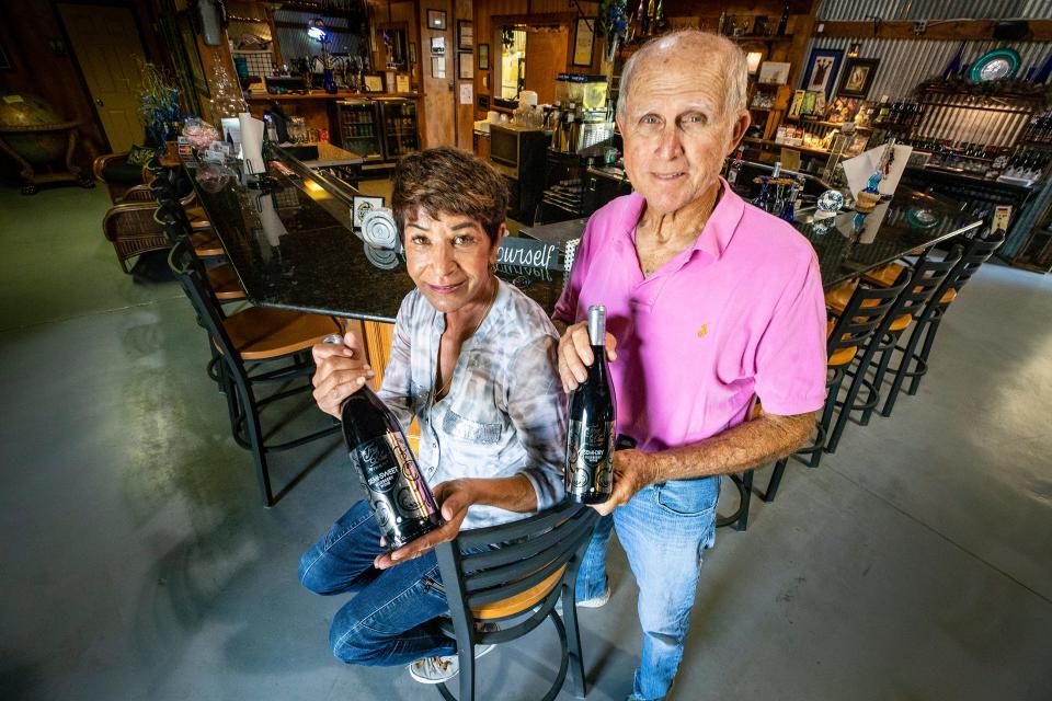 Howard and Fatima Gill with some of their blueberry wine at their True Blue Winery in Davenport Fl. Tuesday May 17,  2022.  ERNST PETERS/ THE LEDGER
