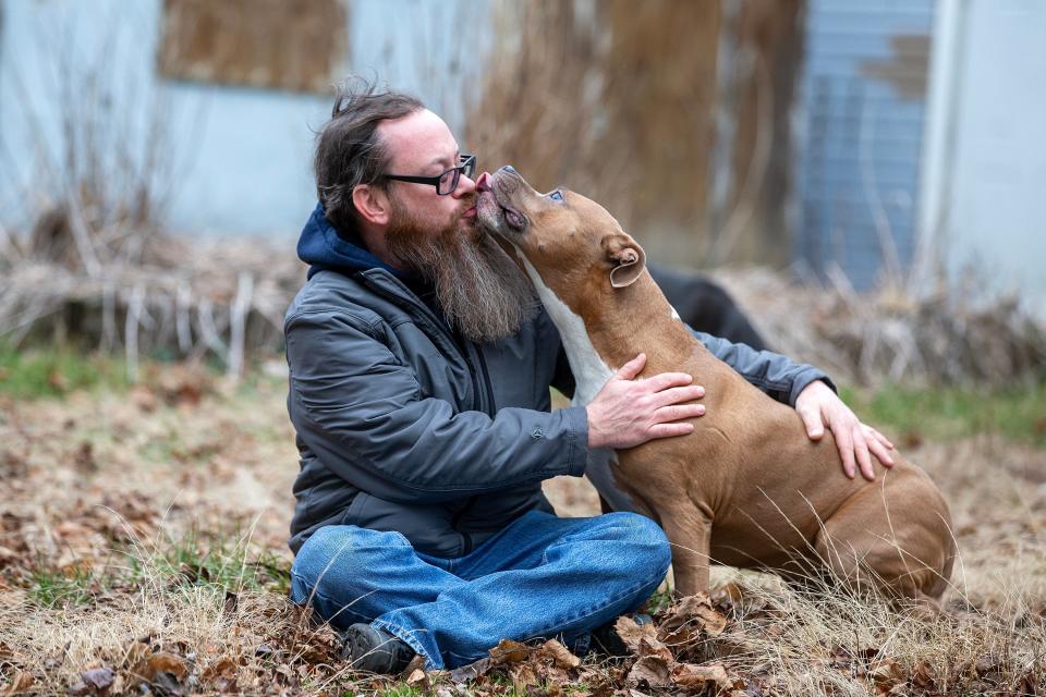 Richard Osthoff, a Howell veteran who accused New York Rep. George Santos of using an alias and scamming him out of money raised for his dying dog, greets his dog, Ruby, at his current residence in Freehold, NJ Monday, February 6, 2023. 