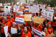 <p>Activists Rally holds up signs at the Florida State Capitol For Gun Law Reform Legislation in Tallahassee, Florida. In the wake of a few week’s ago deadly mass shooting that left 17 people dead, hundreds of supporters joined the Parkland students to call for gun reform. (Don Juan Moore/Getty Images) </p>