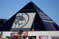 Workers prepare Allegiant Stadium prior to Super Bowl 58, Tuesday, Jan. 30, 2024, in Las Vegas. Las Vegas is scheduled to host the Super Bowl 58 on Sunday, Feb. 11, 2024. (AP Photo/Matt York)