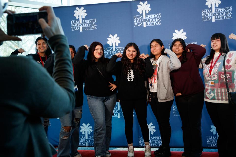 Meryland Gonzalez, center, the star of "Team Meryland," poses for a photo with local high school students Thursday during Student Screening Day of the Palm Springs International Film Festival at Indio High School.