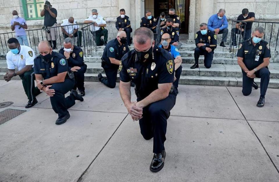 Police chiefs from various cities in Miami-Dade County, including Chief Ed Hudak, of Coral Gables, knelt during protests over George Floyd’s death.