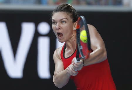 Tennis - Australian Open - Margaret Court Arena, Melbourne, Australia, January 22, 2018. Simona Halep of Romania hits a shot against Naomi Osaka of Japan. REUTERS/Issei Kato