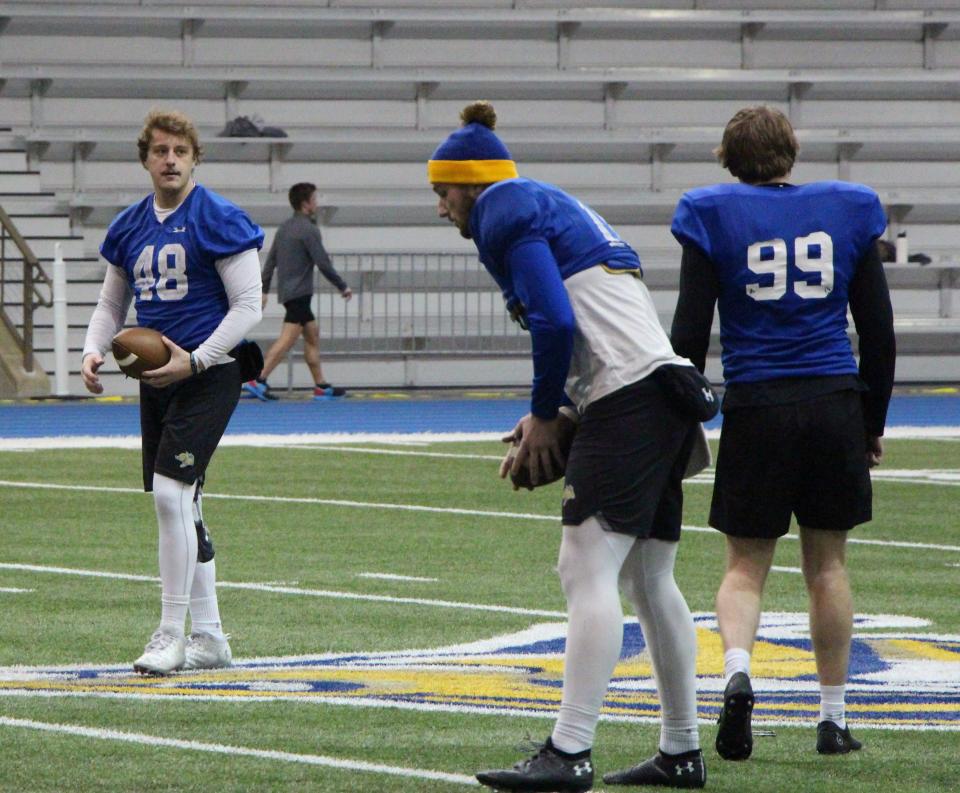 SDSU longsnapper Jaden Mueller (48) works with kickers Hunter Dustman (center) and Jack Green (99) during a practice Tuesday at the S-JAC.