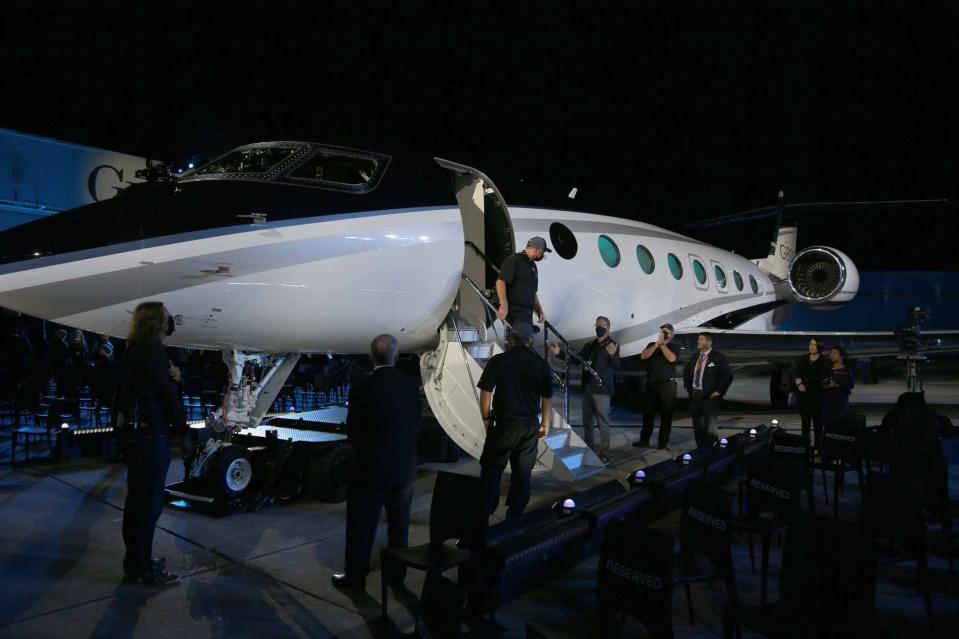 A Gulfstream employee exits the G800 after it was introduced during a special event at Gulfstream Aerospace in Savannah.