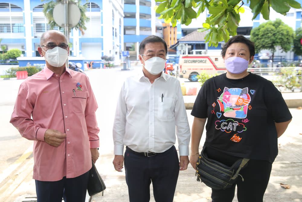 (From left) Datuk Seri Rosli Sulaiman, Cheras MP Tan Kok Wai, and Chai Mei Li are seen in front of the Dang Wangi district police headquarters in Kuala Lumpur January 10, 2022. — Picture by Choo Choy May