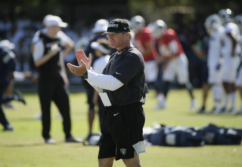 Oakland Raiders head coach Jon Gruden claps during NFL football training camp Thursday, Aug. 8, 2019, in Napa, Calif. Both the Oakland Raiders and the Los Angeles Rams held a joint practice before their upcoming preseason game on Saturday. (AP Photo/Eric Risberg)