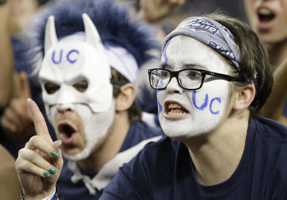 Connecticut fans cheer before the NCAA Final Four tournament college basketball championship game against Kentucky Monday, April 7, 2014, in Arlington, Texas. (AP Photo/Tony Gutierrez)