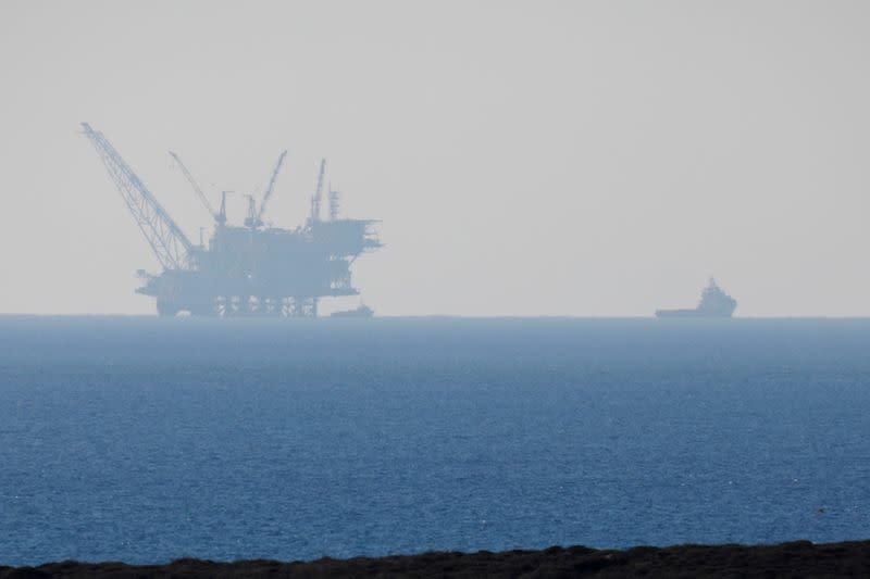 FILE PHOTO: An Israeli navy boat is seen next to the production platform of Leviathan natural gas field in the Mediterranean Sea near Kibbutz Nahsholim in northern Israel