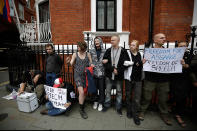 LONDON, ENGLAND - AUGUST 16: Supporters of Julian Assange, the founder of the WikiLeaks website, gather outside the Ecuadorian Embassy on August 16, 2012 in London, England. Mr Assange has been living inside Ecuador's London embassy since June 19, 2012 after requesting political asylum whilst facing extradition to Sweden to face allegations of sexual assault. (Photo by Matthew Lloyd/Getty Images)